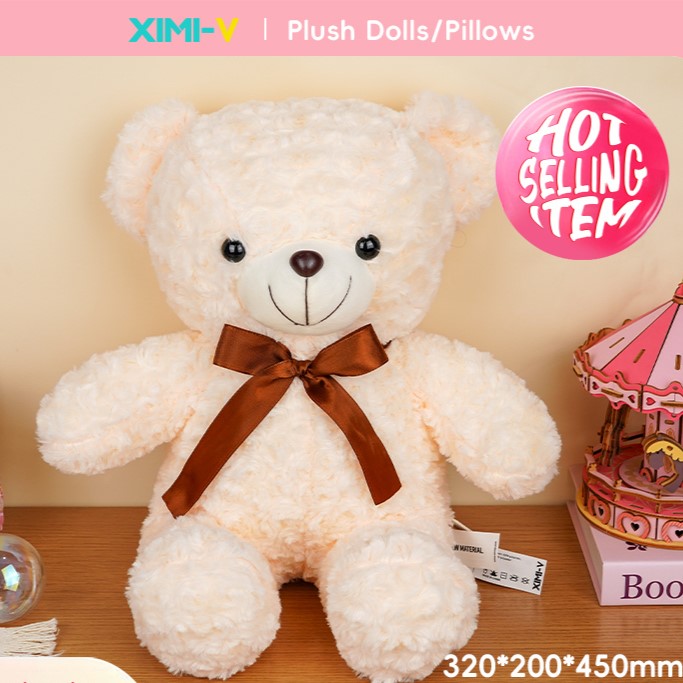 دمية دب مخملي بشرائط الورد لون أبيض