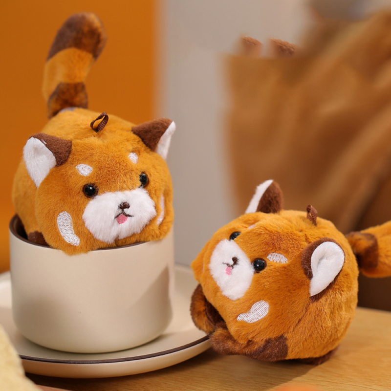 لعبة باندا أحمر يهز الذيل (برتقالي)