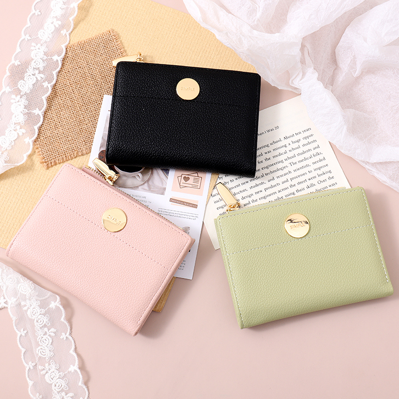 محفظة نسائية مزدوجة الطي بملمس دائري بسيط