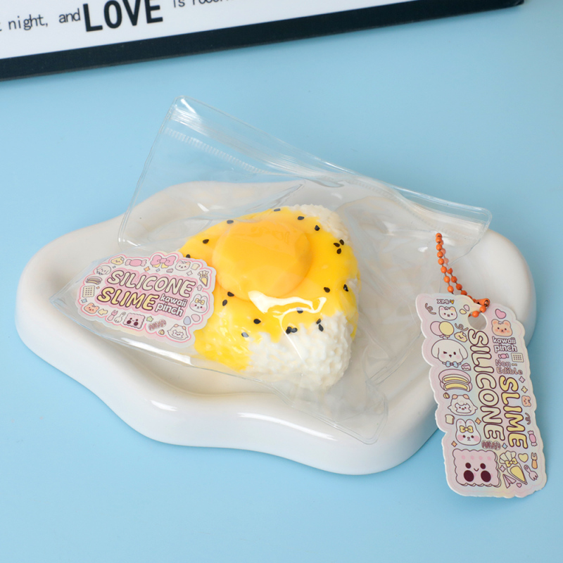 لعبة ضغط سيليكون رول الأرز الصفار (أصفر)