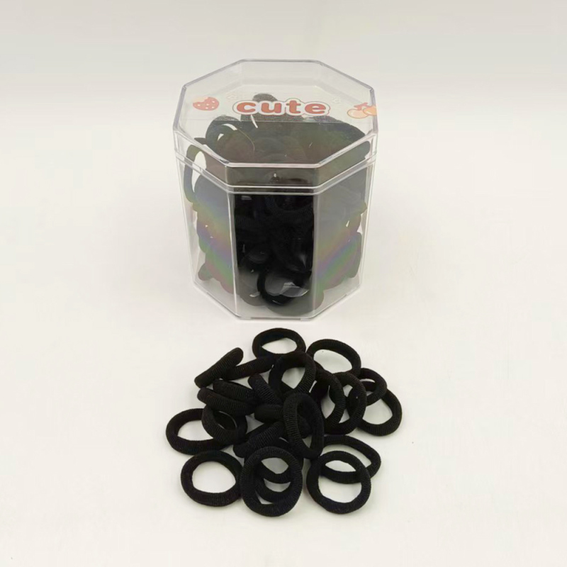 ربطات شعر سوداء في علبة ثُمانية الجوانب