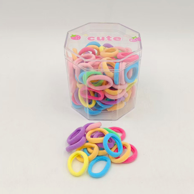 ربطات شعر ملونة في علبة ثُمانية الجوانب